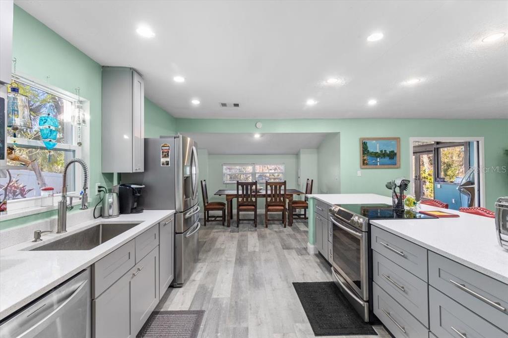 7226 Alafia Ridge Loop Riverview, FL 33569 - Photo 13 of 51 a kitchen with lots of counter top space and stainless steel appliances