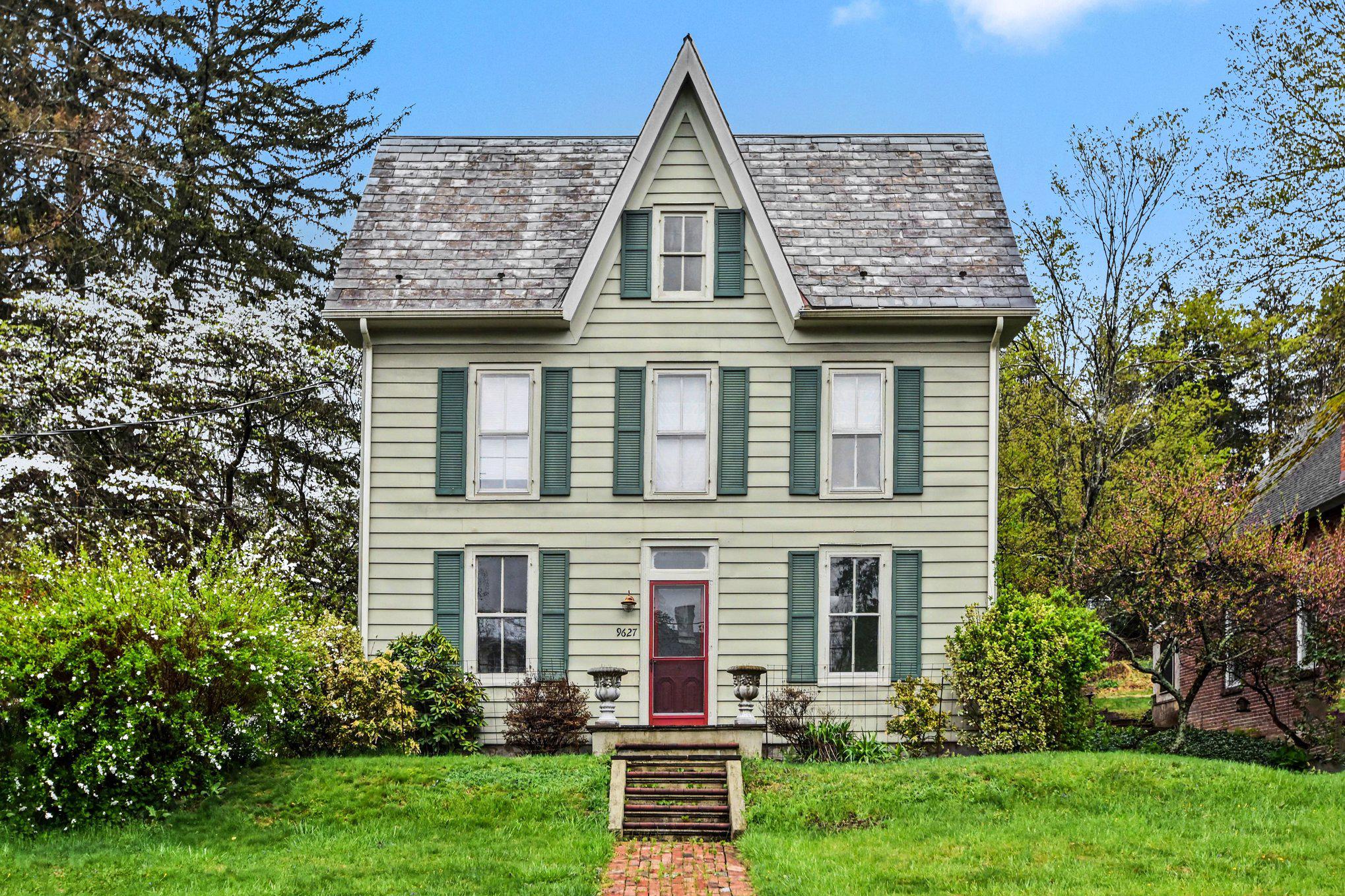 front view of a house with a yard