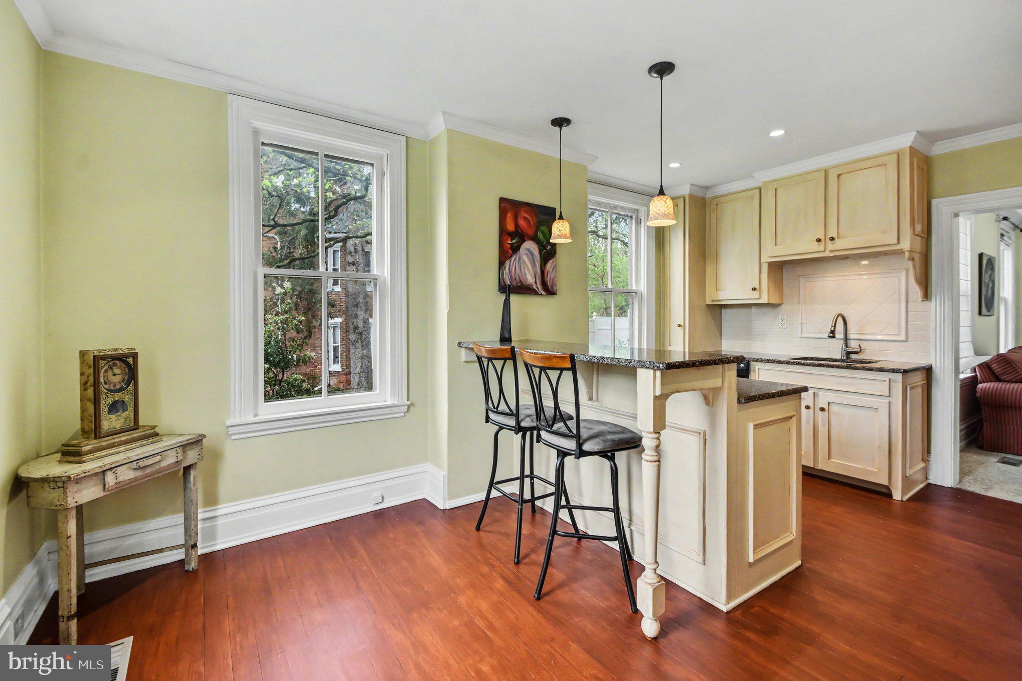 9627 Easton Road Upper Black Eddy, PA 18972 - Photo 15 of 28 a kitchen with white cabinets and wooden floor