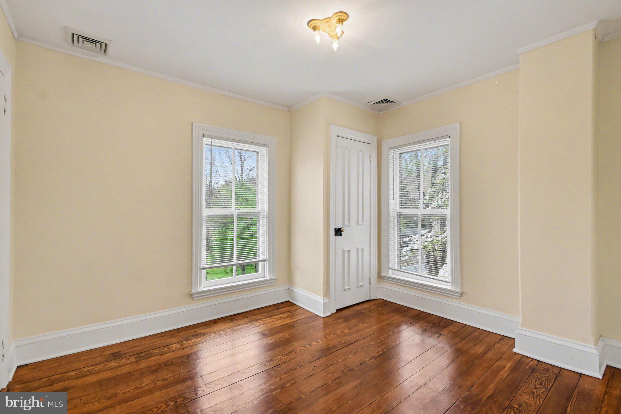 9627 Easton Road Upper Black Eddy, PA 18972 - Photo 23 of 28 an empty room with wooden floor and windows