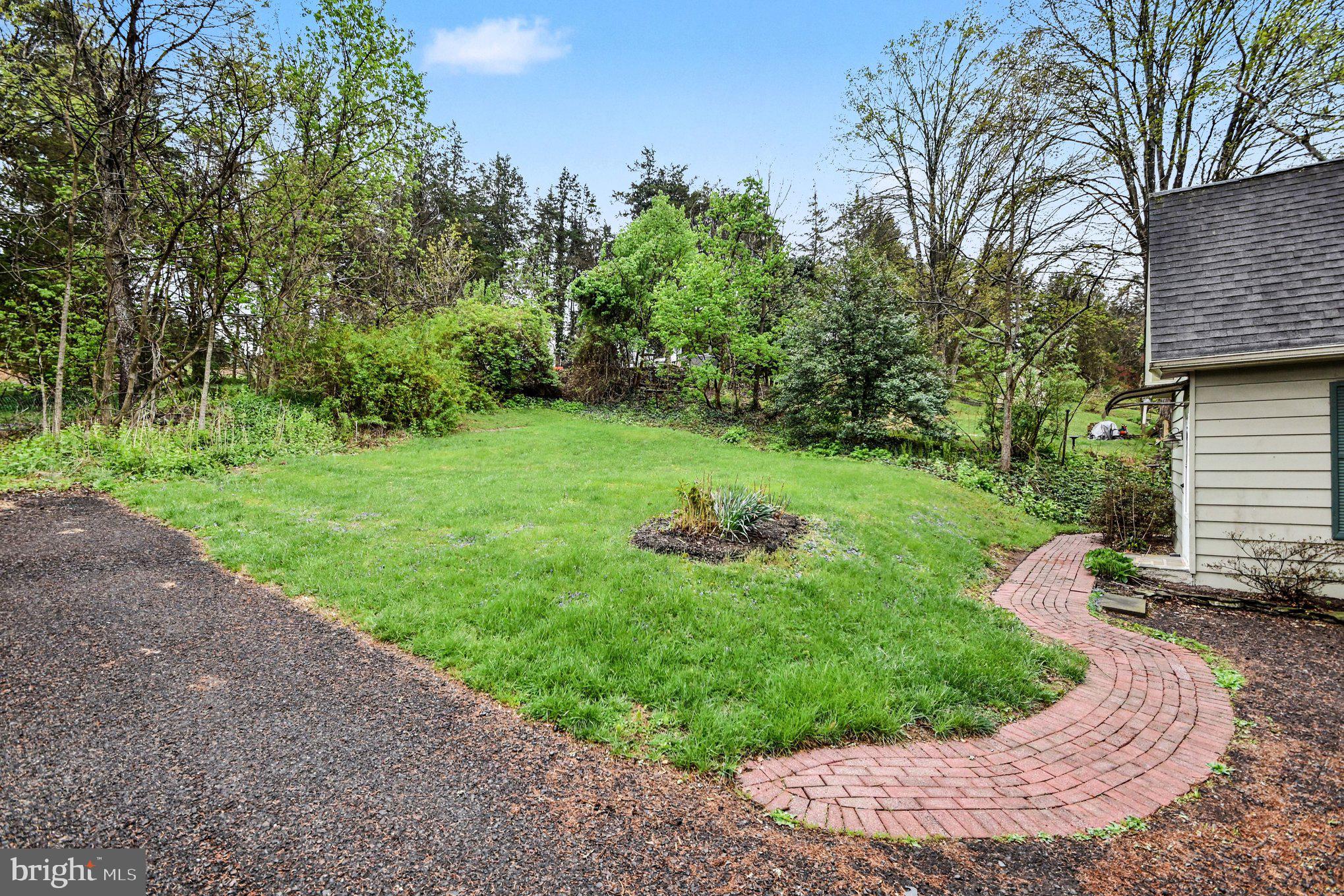 9627 Easton Road Upper Black Eddy, PA 18972 - Photo 26 of 28 a view of a backyard with large trees