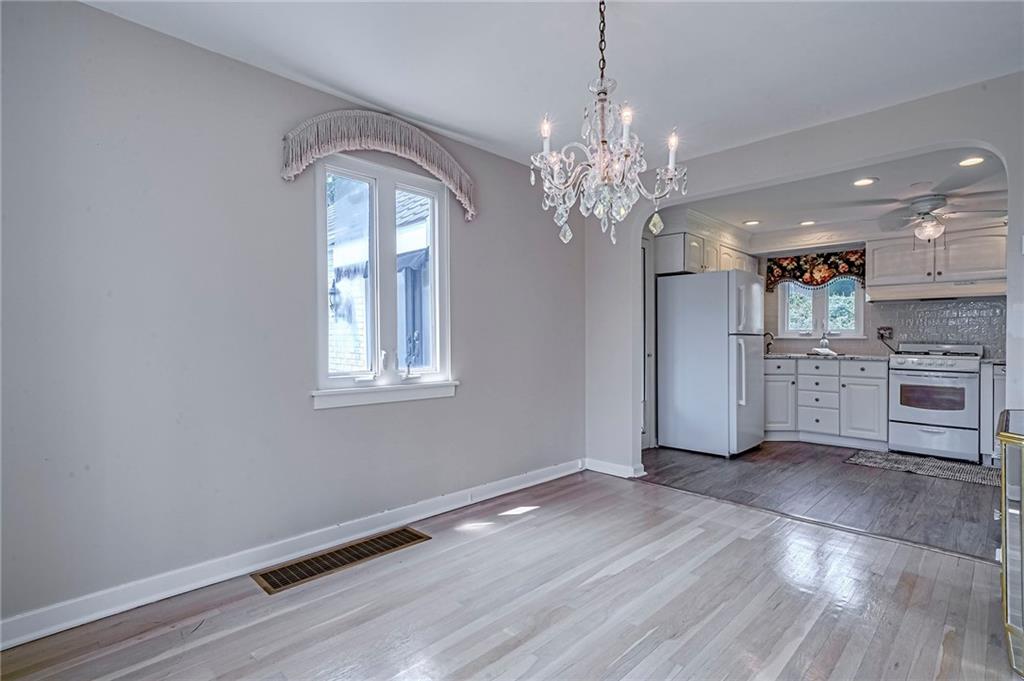 12 Kennedy Lane McKees Rocks, PA 15136 - Photo 14 of 29 a view of a kitchen with a dishwasher cabinets and a large window