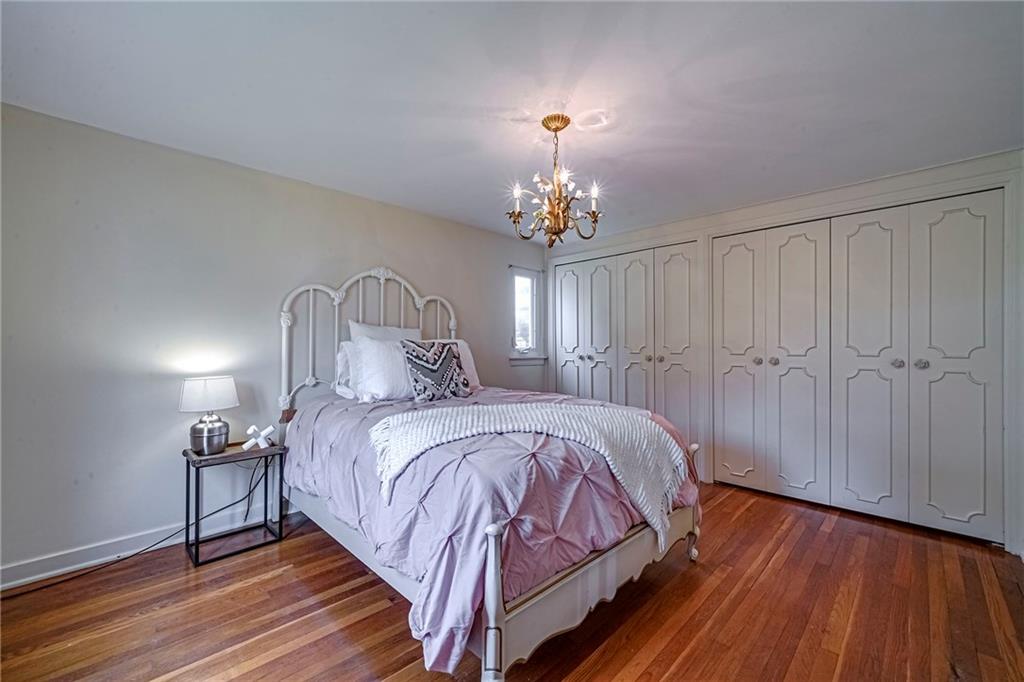 12 Kennedy Lane McKees Rocks, PA 15136 - Photo 18 of 29 a bedroom with a bed and wooden floor