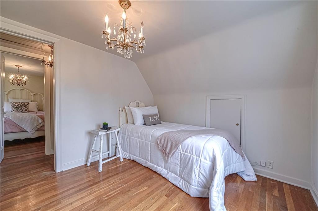 12 Kennedy Lane McKees Rocks, PA 15136 - Photo 20 of 29 a bedroom with a bed and wooden floor