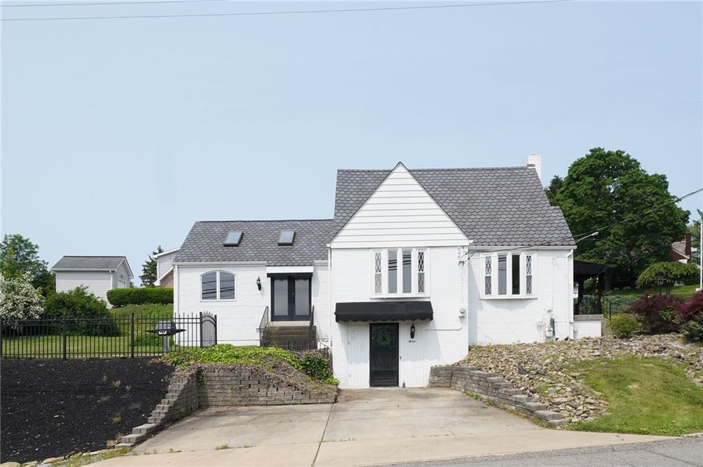 12 Kennedy Lane McKees Rocks, PA 15136 - Photo 2 of 29 a view of a white house with a sink and yard