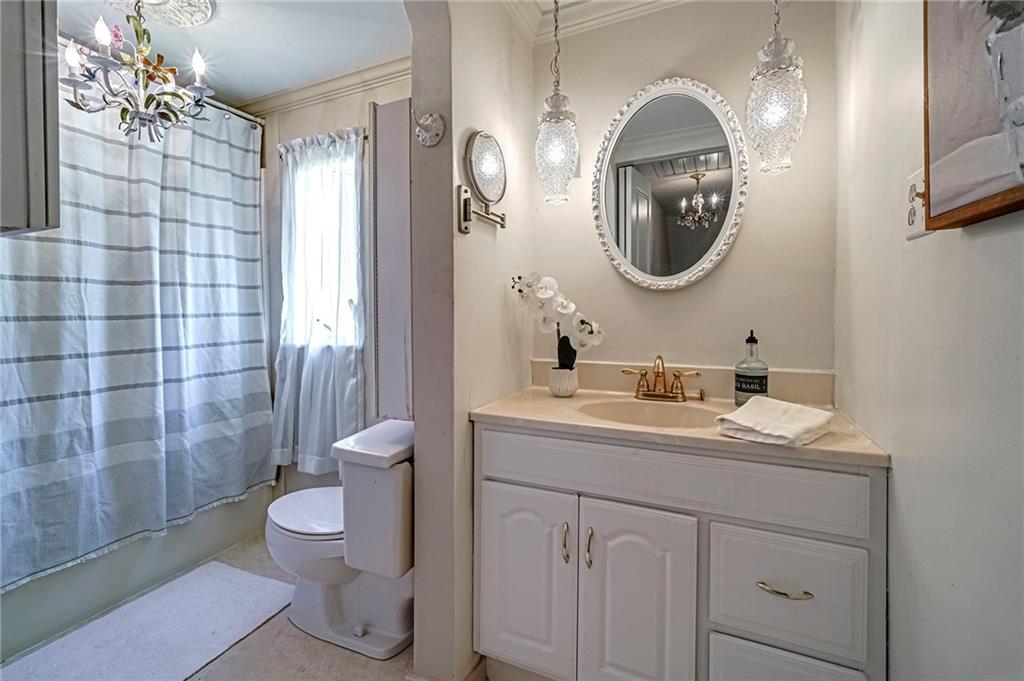 12 Kennedy Lane McKees Rocks, PA 15136 - Photo 22 of 29 a bathroom with a toilet a sink and mirror