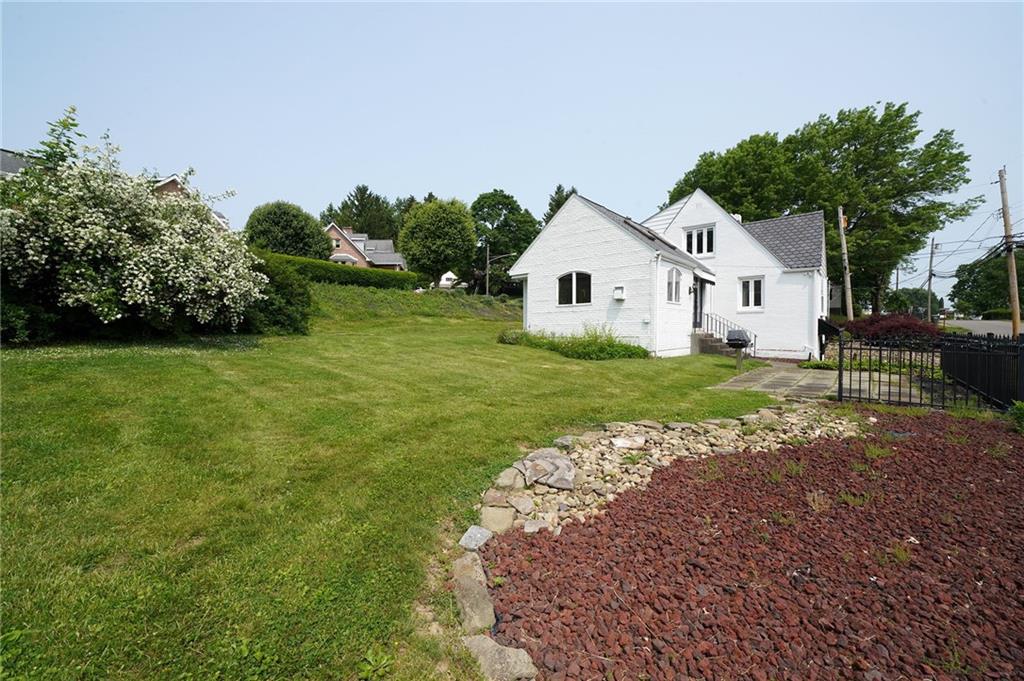 12 Kennedy Lane McKees Rocks, PA 15136 - Photo 26 of 29 a view of a house with a yard
