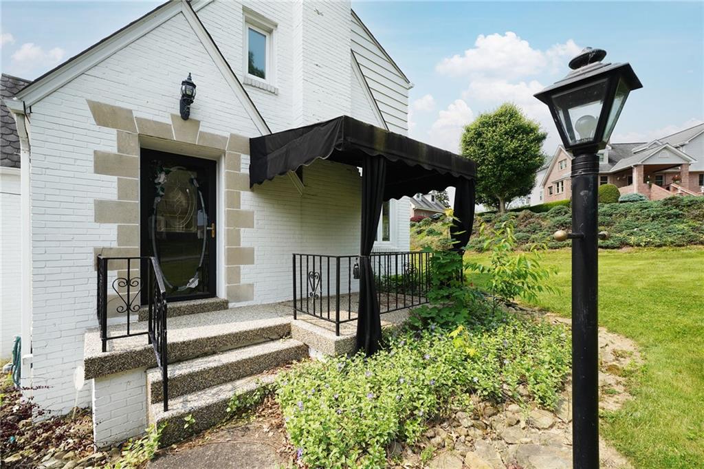 12 Kennedy Lane McKees Rocks, PA 15136 - Photo 3 of 29 a front view of a house with garden