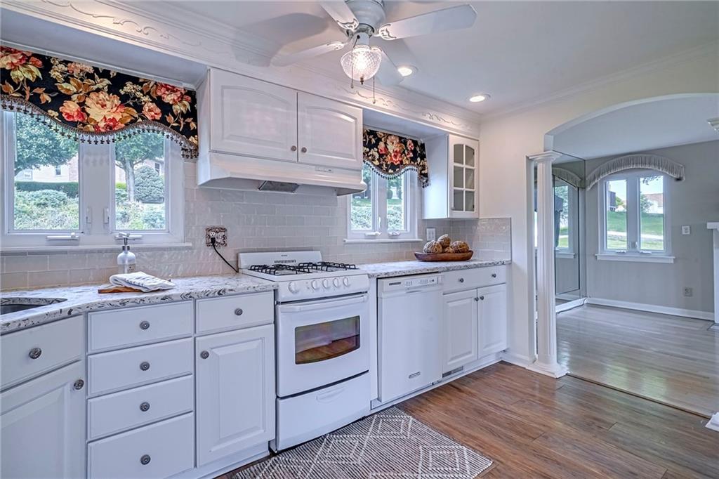 12 Kennedy Lane McKees Rocks, PA 15136 - Photo 8 of 29 a kitchen with a stove a sink and a refrigerator