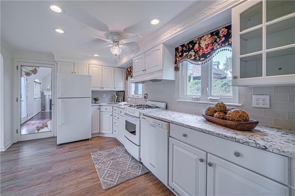 12 Kennedy Lane McKees Rocks, PA 15136 - Photo 9 of 29 a kitchen with a white wooden cabinets and white appliances