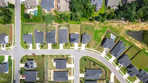 a view of swimming pool with outdoor seating and city view
