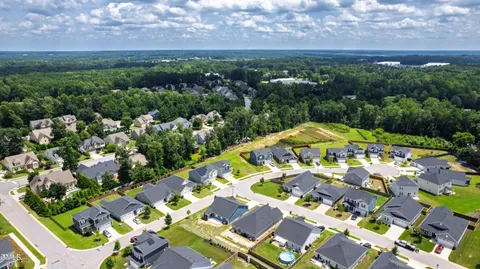 a view of a swimming pool with a yard