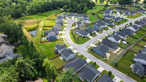 an aerial view of residential house with outdoor space and swimming pool