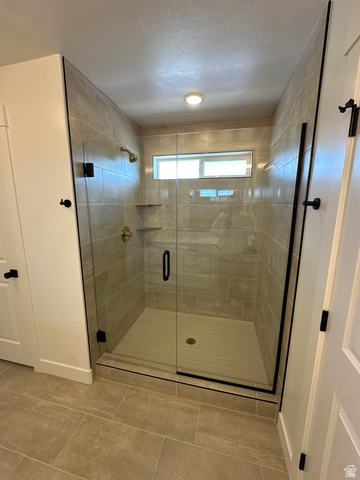 1225 West 500 South Logan, UT 84321 - Photo 35 of 39 Spacious walk-in shower with clear glass enclosure and matte black hardware