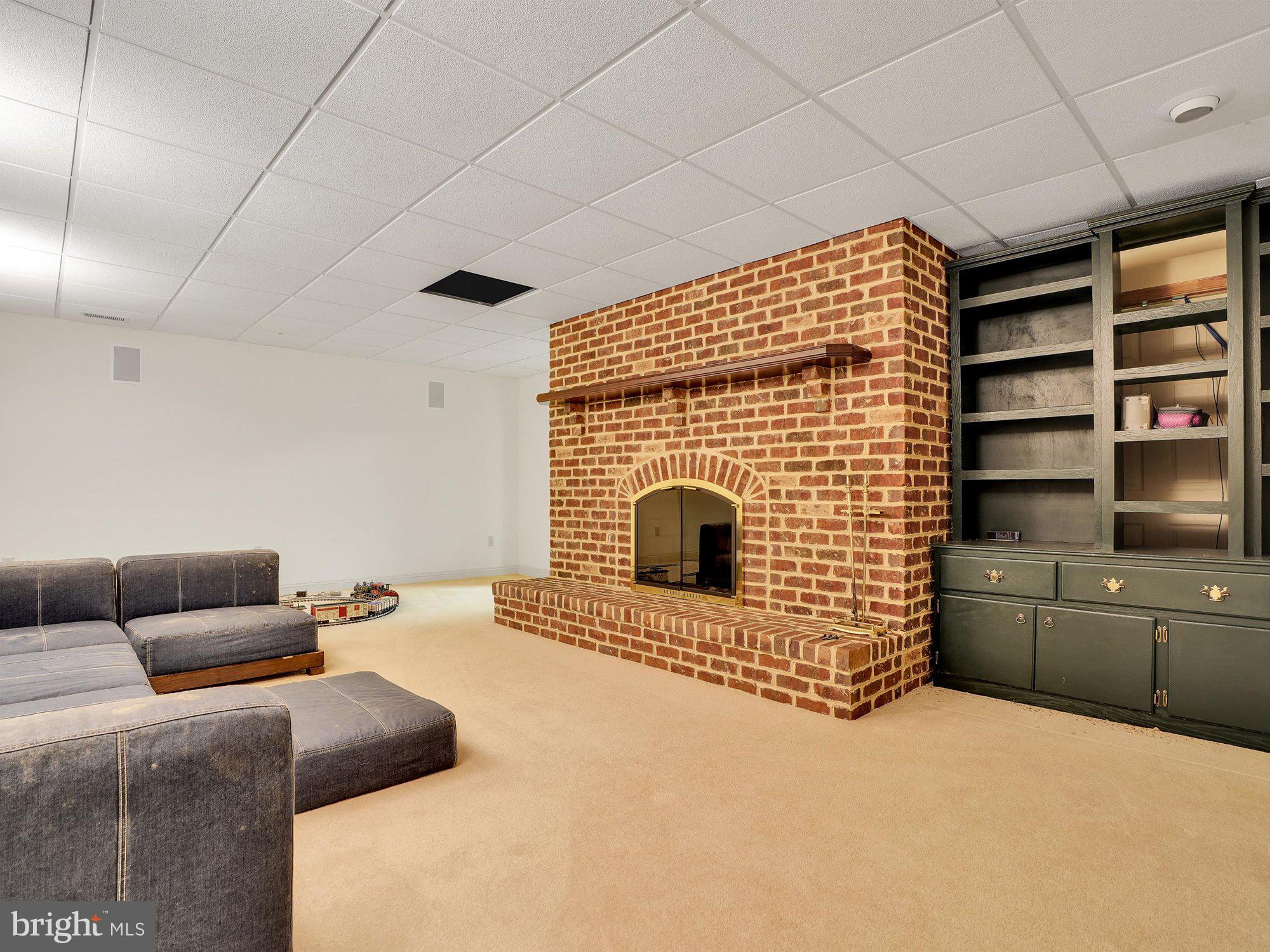 703 Norris Road Airville, PA 17302 - Photo 47 of 72 Finished family room in basement with brick WB FP