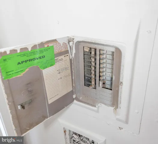 a close view of dining table with chairs