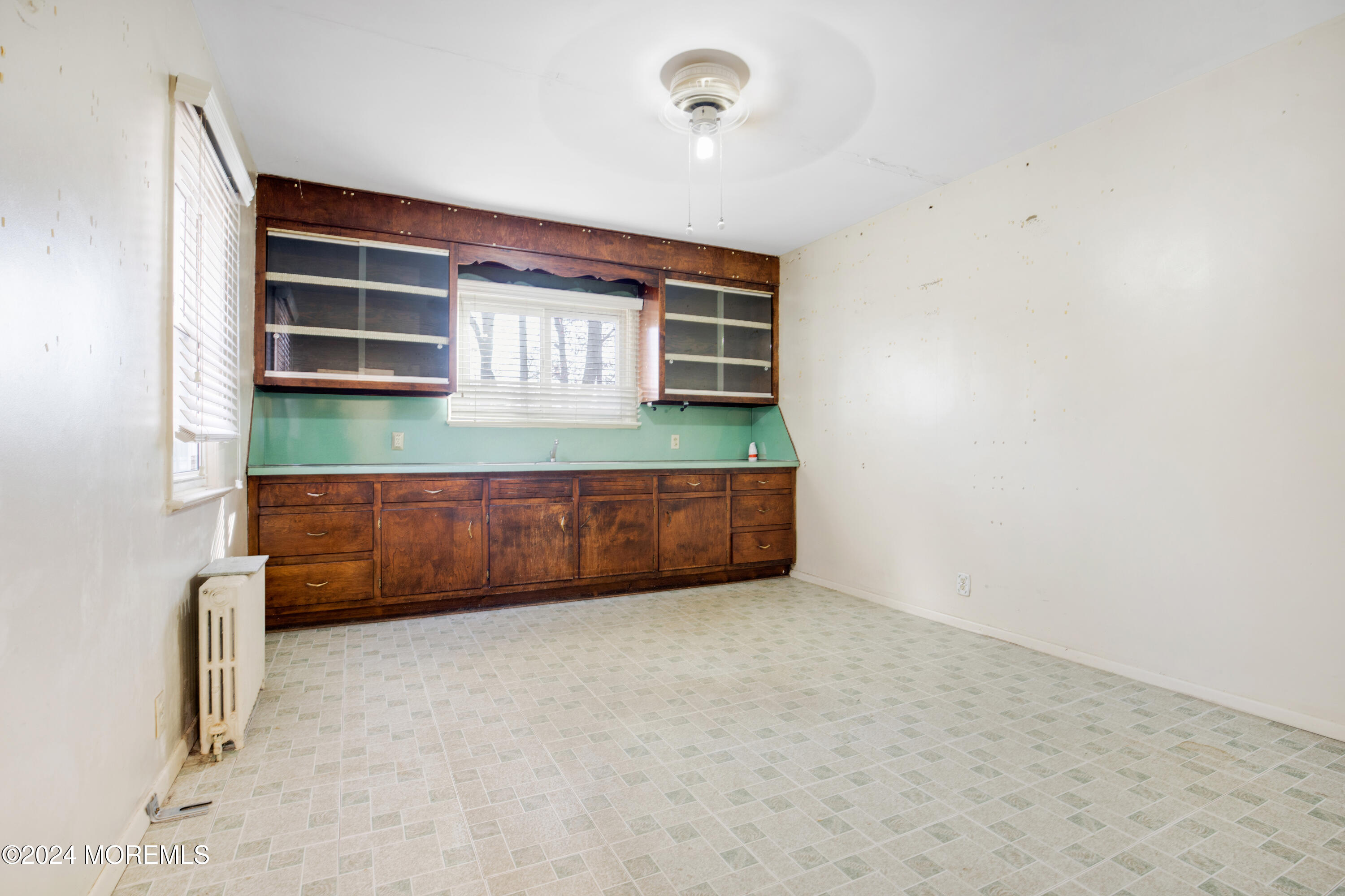 552 Hyson Road Jackson, NJ 08527 - Photo 20 of 23 a view of an empty room with a fireplace and a window