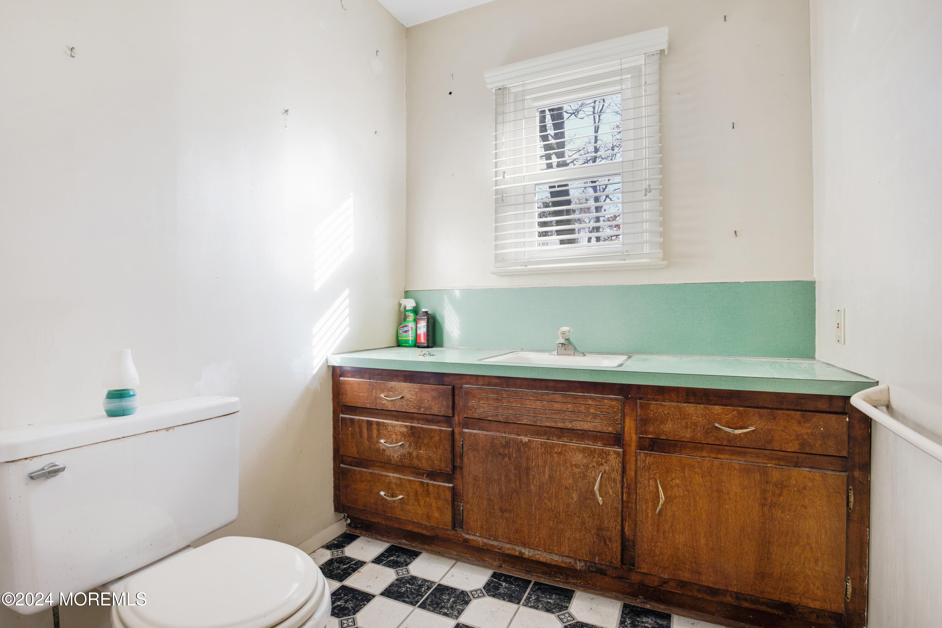 552 Hyson Road Jackson, NJ 08527 - Photo 5 of 23 a bathroom with a toilet sink and window
