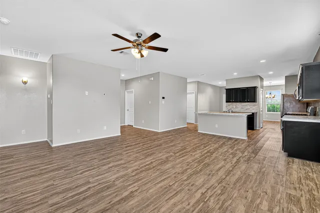 a view of a livingroom with a kitchen