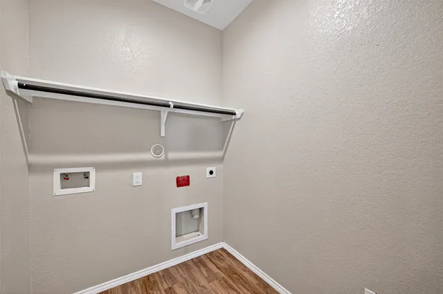 a view of storage and utility room with empty racks