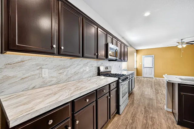 a kitchen with a sink and cabinets
