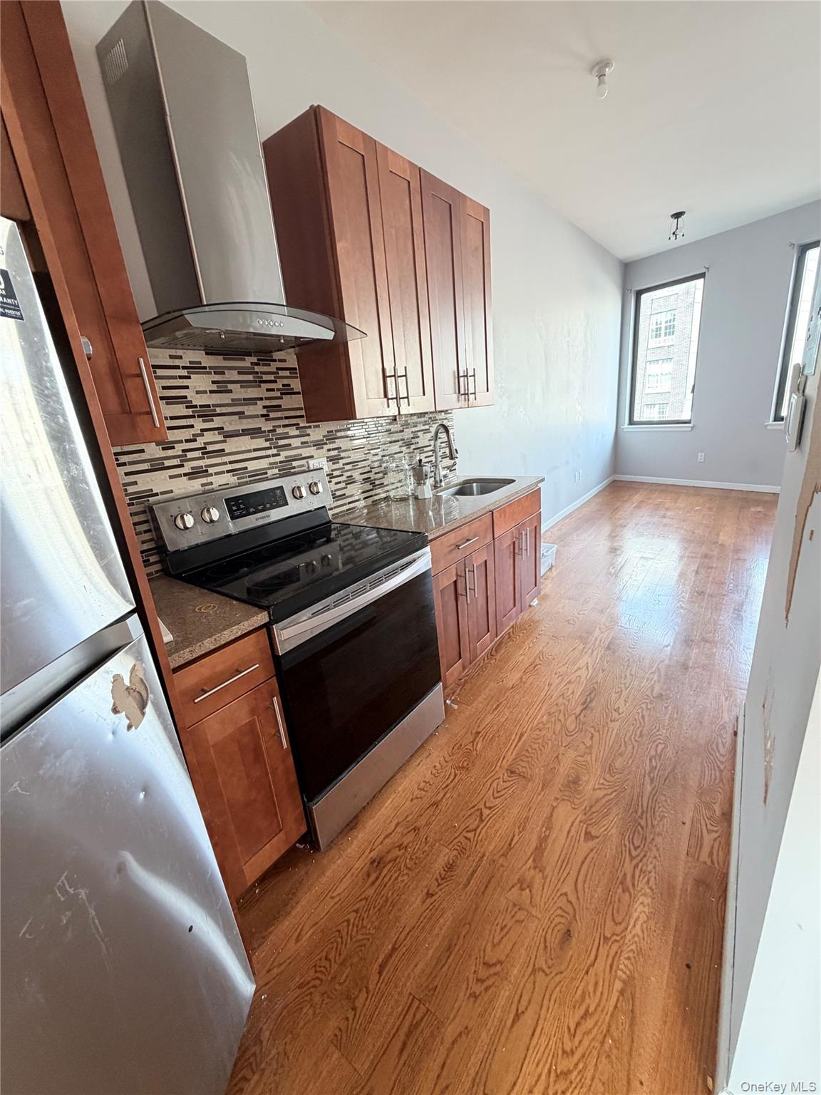 a kitchen with stainless steel appliances granite countertop a stove and a sink