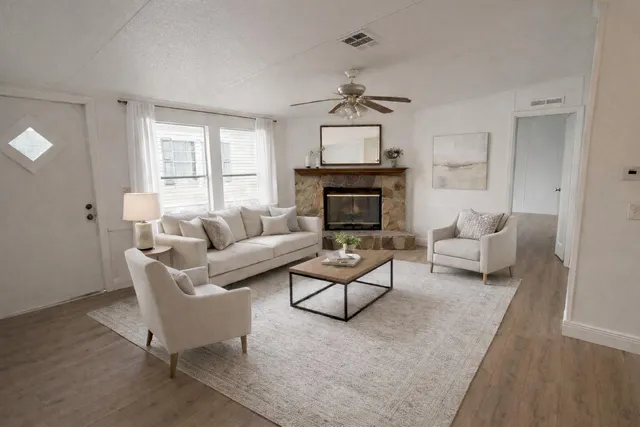 a kitchen with wooden floors and refrigerator