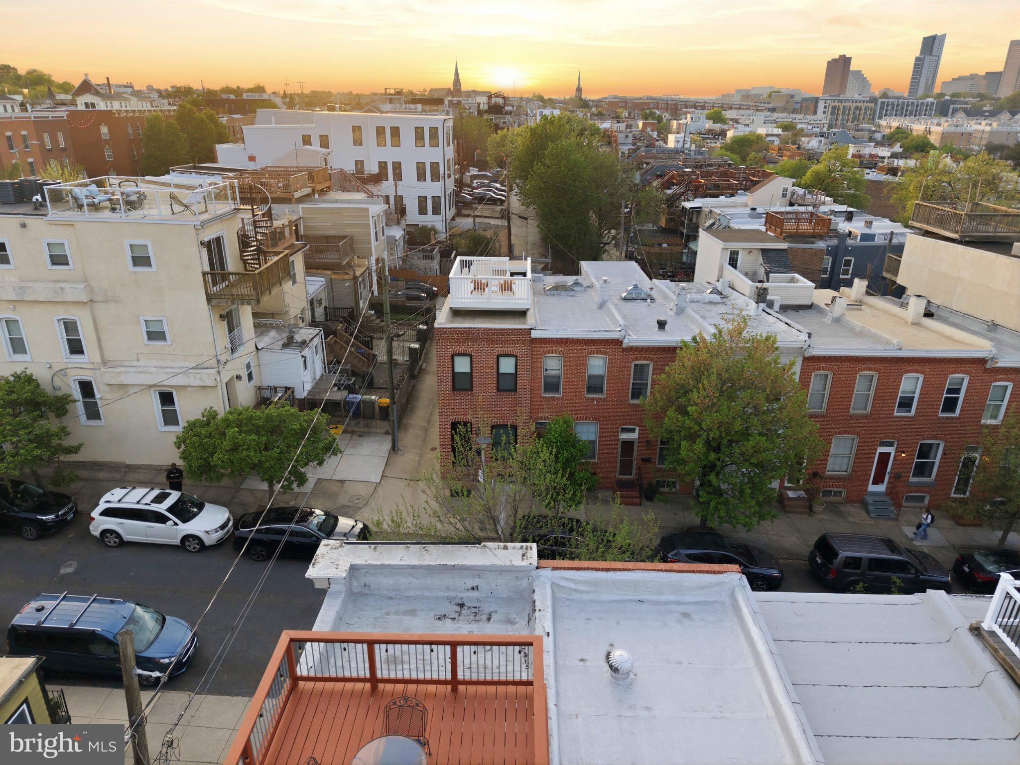 1452 Boyle Street Baltimore, MD 21230 - Photo 42 of 55 Sunset over a charming cityscape.