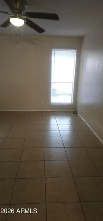 a view of an empty room with windows