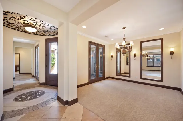 a kitchen with granite countertop a sink a stove and cabinets