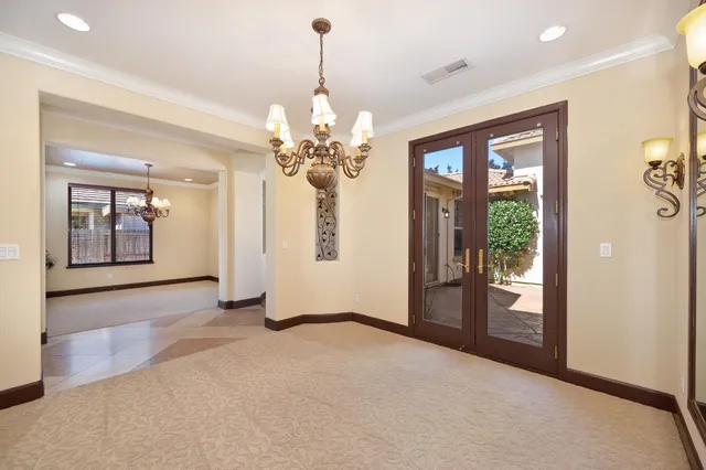 a kitchen with granite countertop a sink stainless steel appliances and cabinets