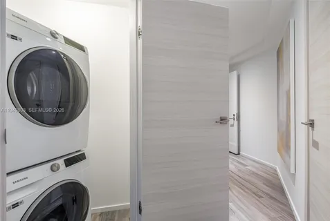 a view of a hallway with washer and dryer