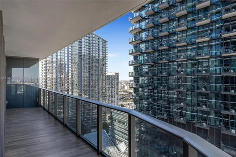 a view of balcony with wooden floor