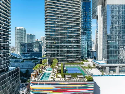 a view of swimming pool and tall buildings