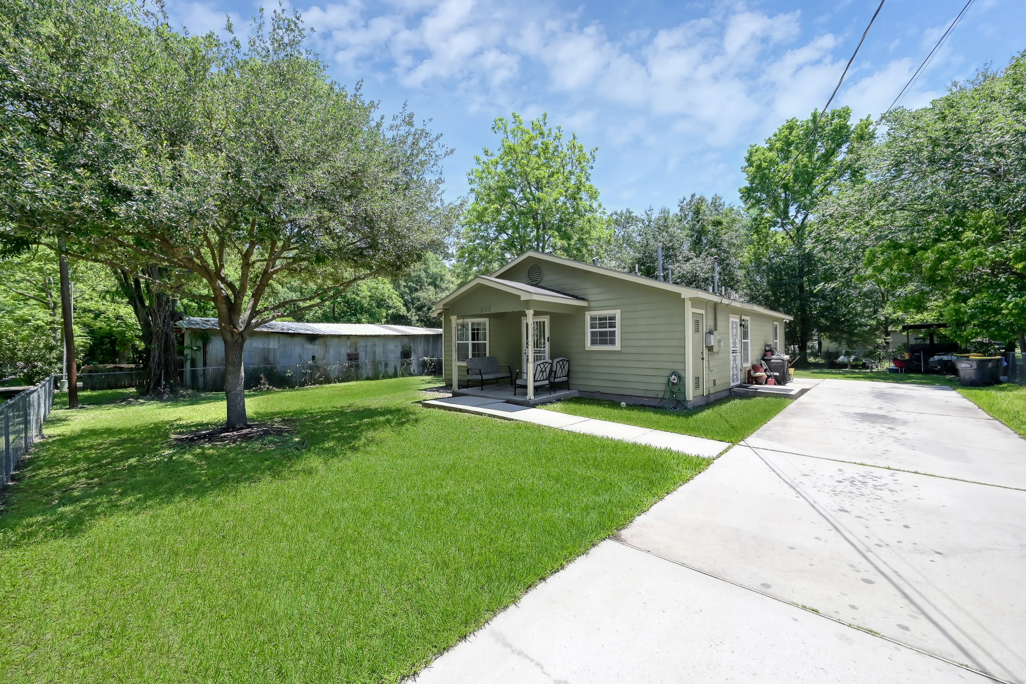 805 Webb Street Conroe, TX 77301 - Photo 1 of 19 a front view of house with a garden