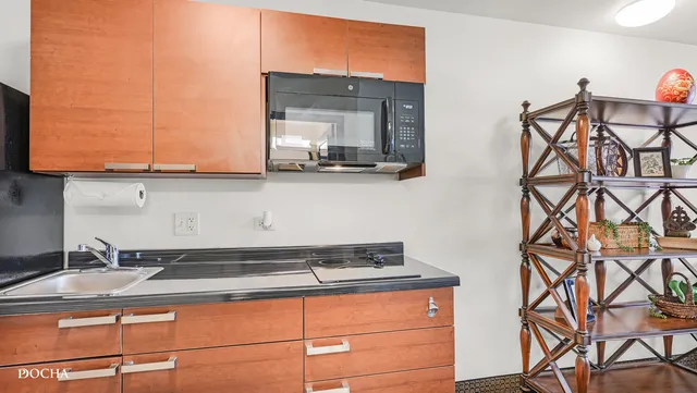 a kitchen with a sink and cabinets