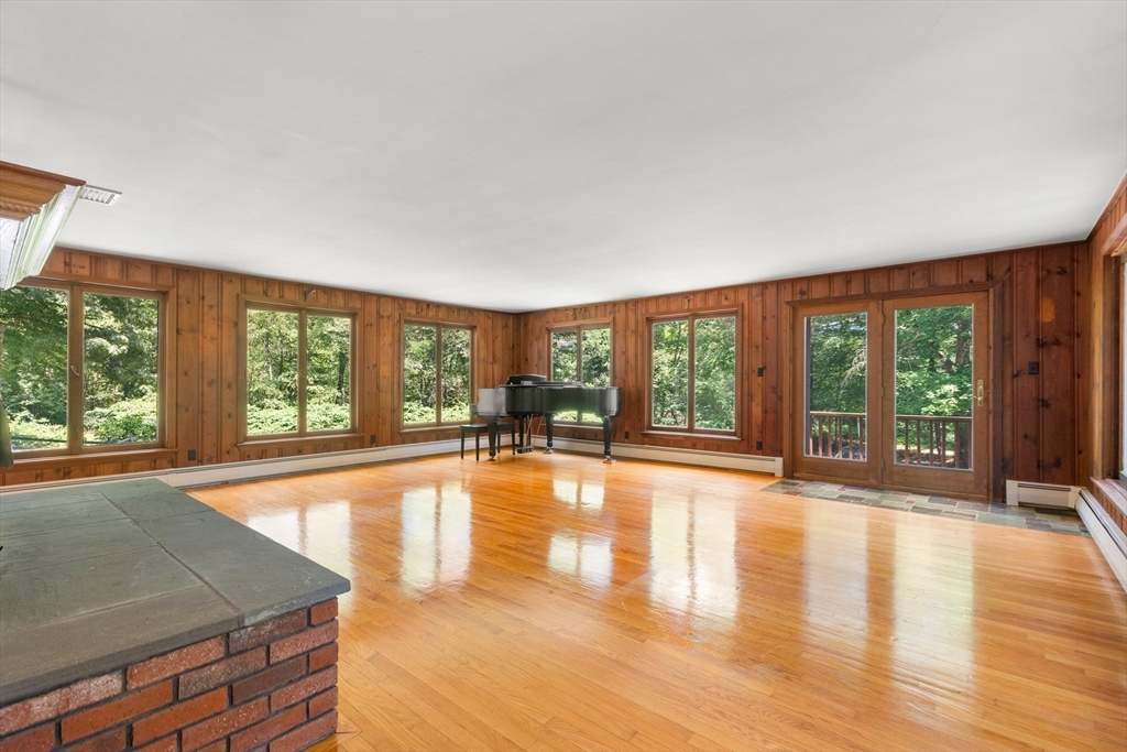 118 Echo Cove Road Hamilton, MA 01982 - Photo 13 of 40 a view of an empty room with wooden floor and a window