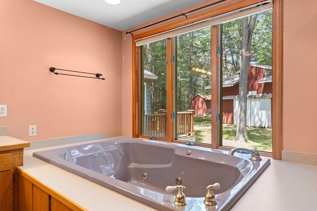 118 Echo Cove Road Hamilton, MA 01982 - Photo 18 of 40 a bath tub sitting in front of a window