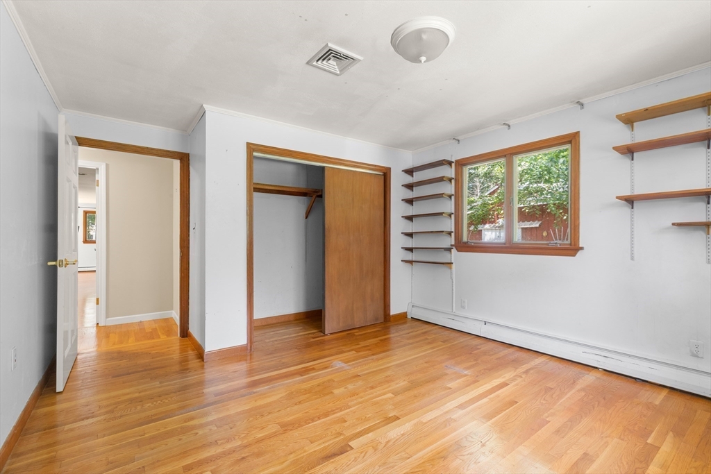 118 Echo Cove Road Hamilton, MA 01982 - Photo 19 of 40 a view of an empty room with wooden floor and a window