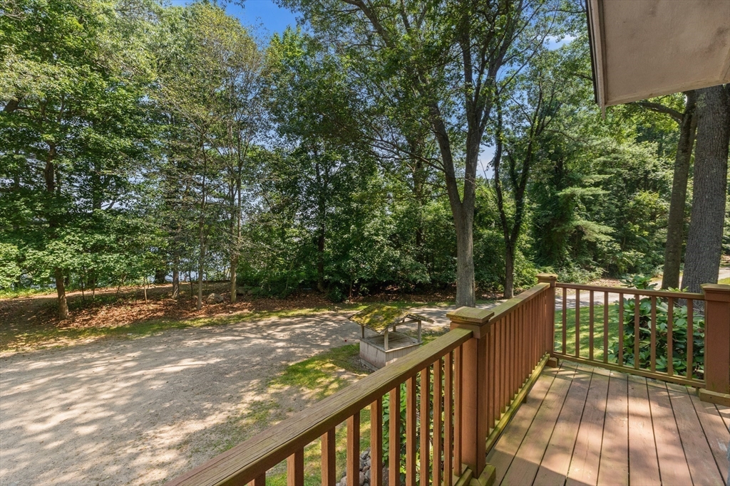 118 Echo Cove Road Hamilton, MA 01982 - Photo 32 of 40 a view of a wooden deck next to a yard