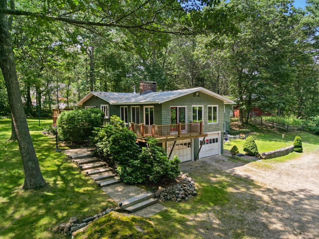 118 Echo Cove Road Hamilton, MA 01982 - Photo 33 of 40 a view of house with swimming pool outdoor seating and trees