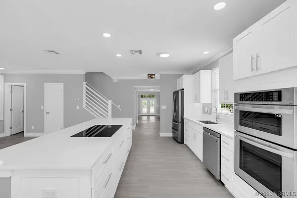 a bathroom with a sink a vanity and mirror