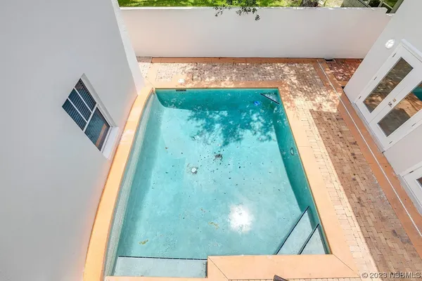 a bathroom with a sink toilet and a mirror