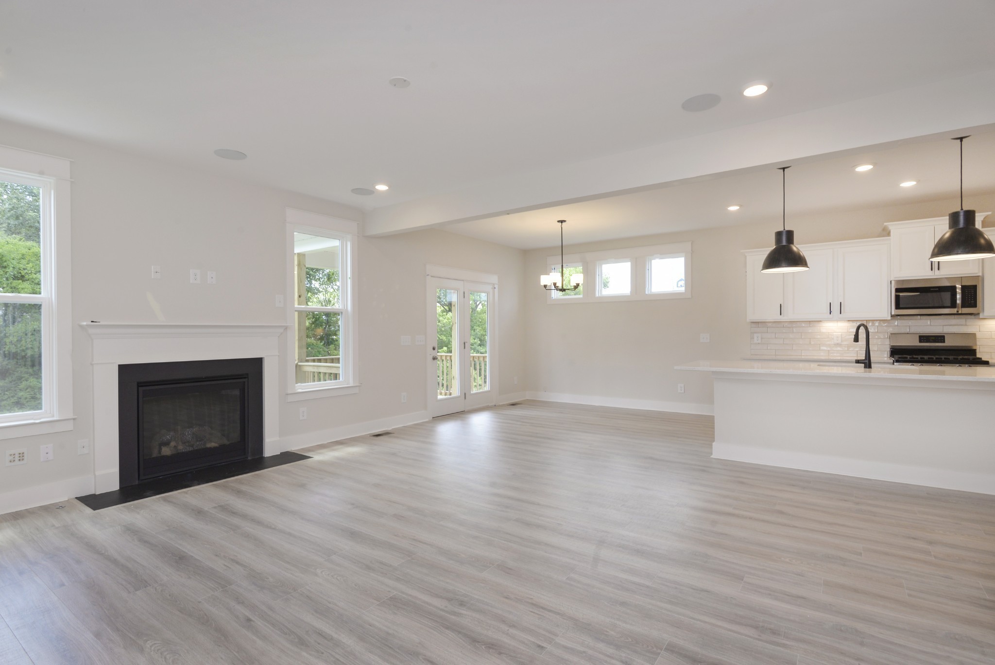79 Remington Road Lebanon, TN 37090 - Photo 19 of 38 a view of an empty room with kitchen and fireplace
