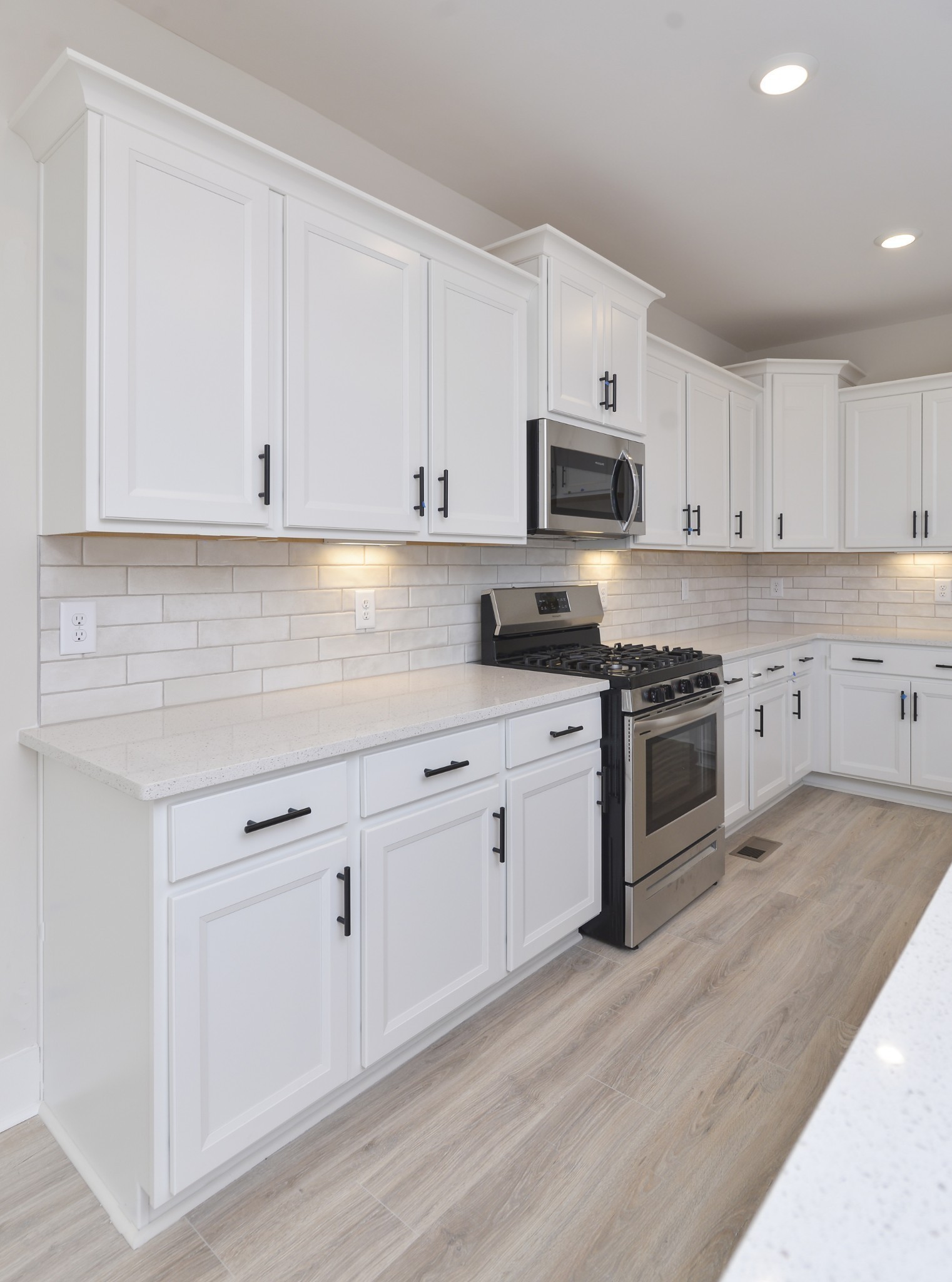 79 Remington Road Lebanon, TN 37090 - Photo 25 of 38 a kitchen with granite countertop white cabinets and stainless steel appliances