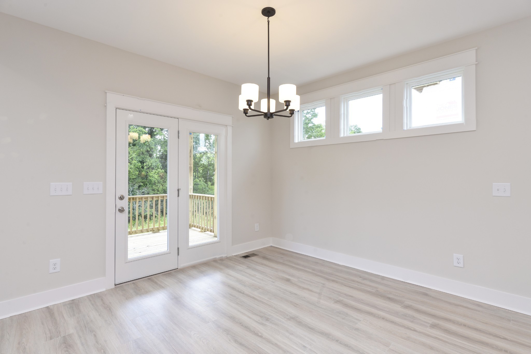 79 Remington Road Lebanon, TN 37090 - Photo 27 of 38 a view of a room with wooden floor chandelier and windows