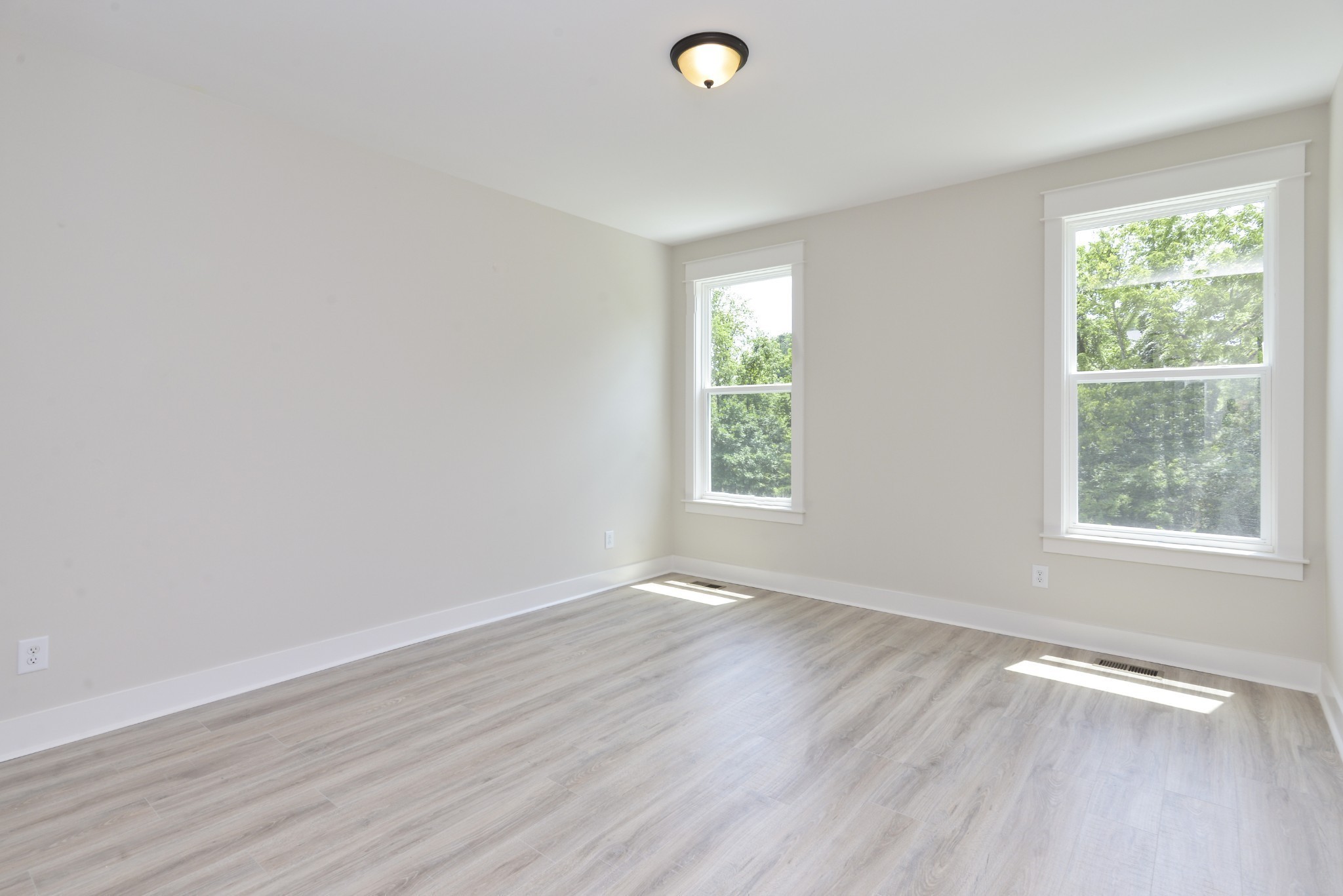 79 Remington Road Lebanon, TN 37090 - Photo 28 of 38 an empty room with wooden floor and windows