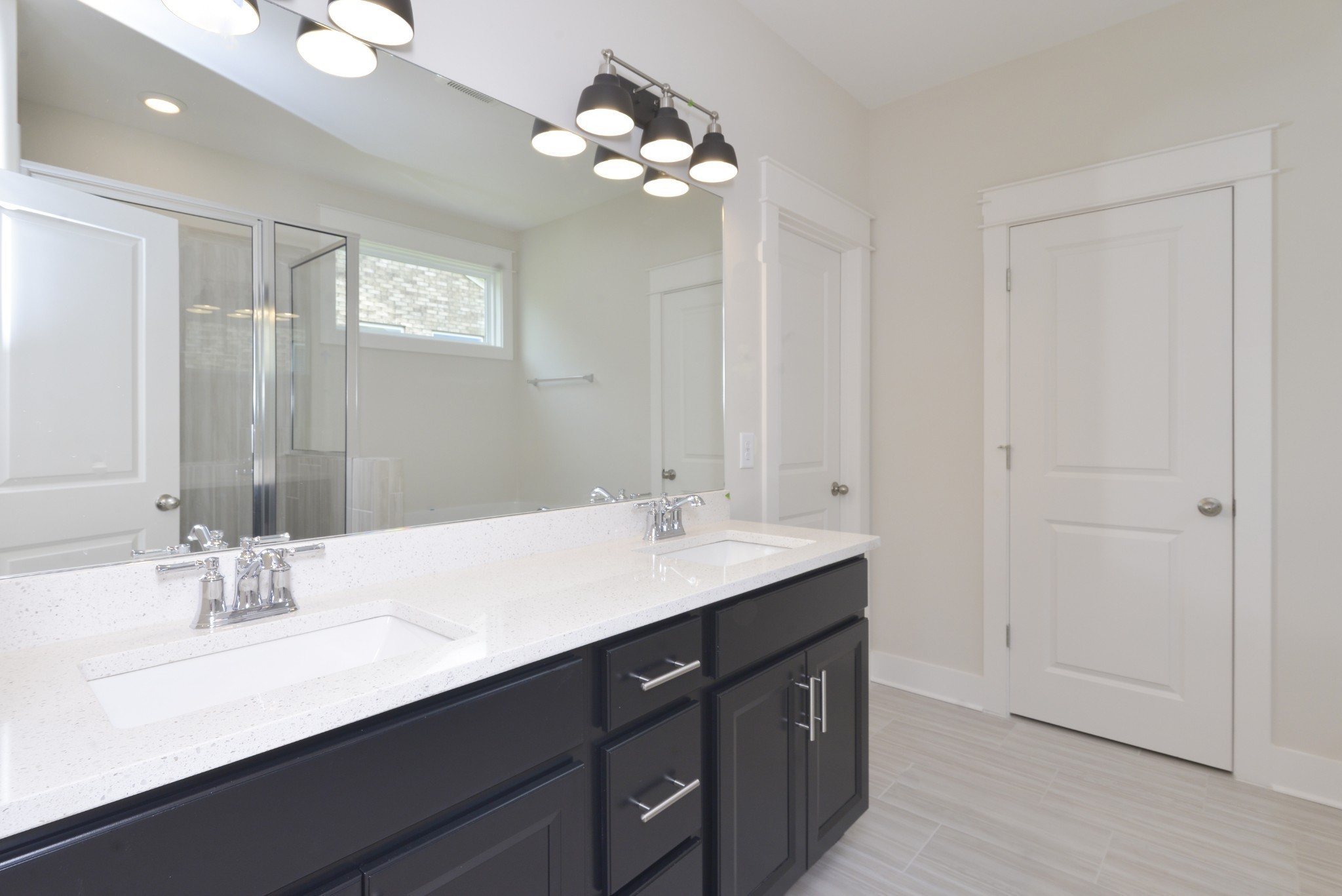 79 Remington Road Lebanon, TN 37090 - Photo 29 of 38 a bathroom with a double vanity sink and a mirror