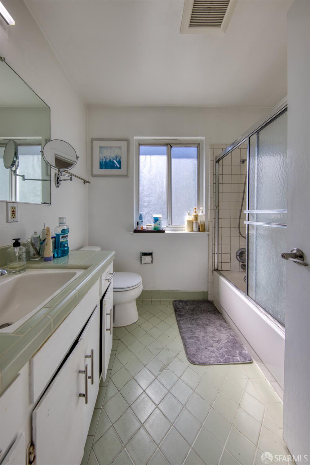 40 Irving Street San Francisco, CA 94122 - Photo 3 of 13 a spacious bathroom with a bathtub shower sink and mirror