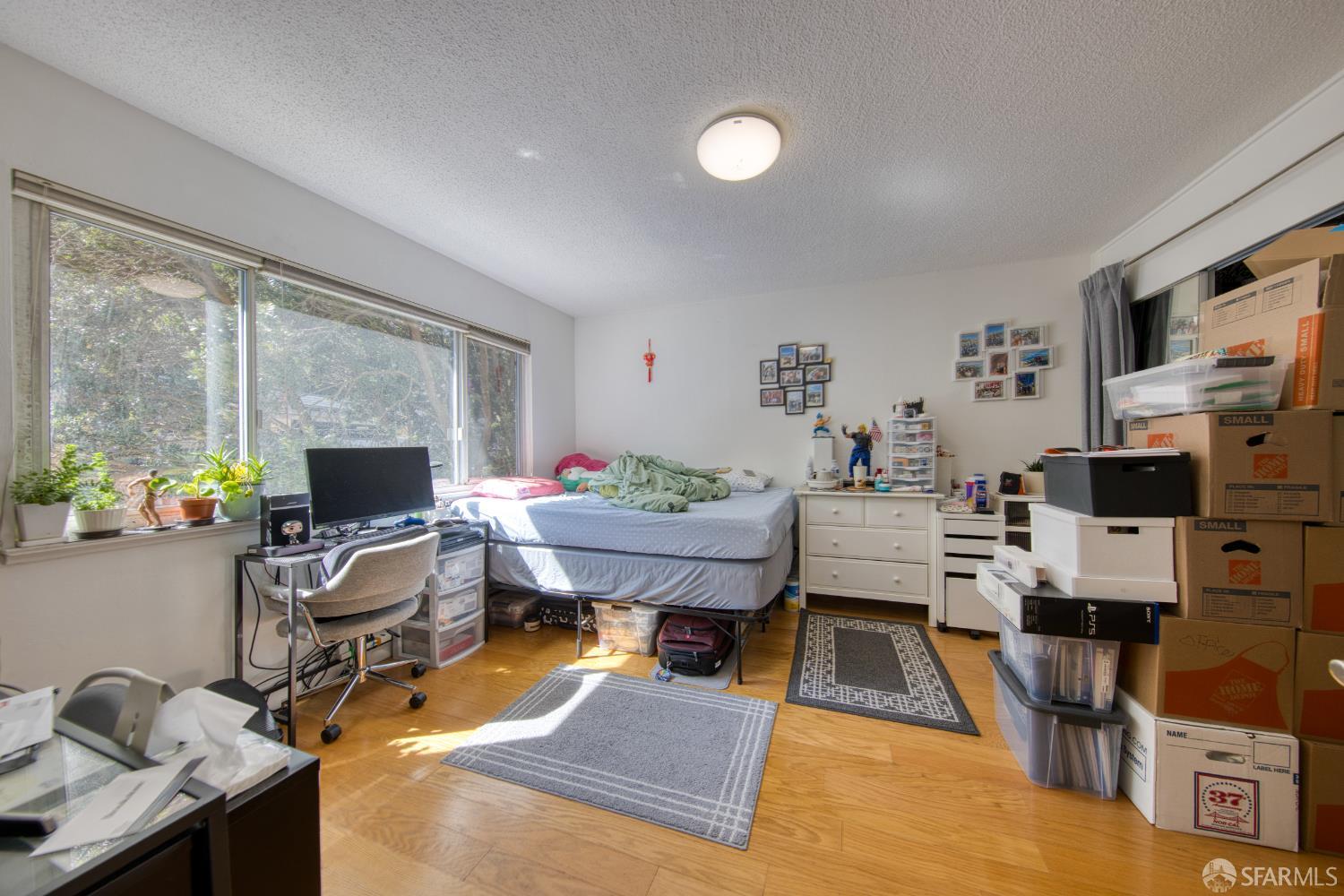 40 Irving Street San Francisco, CA 94122 - Photo 5 of 13 a view of a workspace with furniture and a window